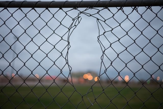 Disruptive Marketing Cheat Sheet 1 disruptive marketing represented by a chainlink fence with a hole in it