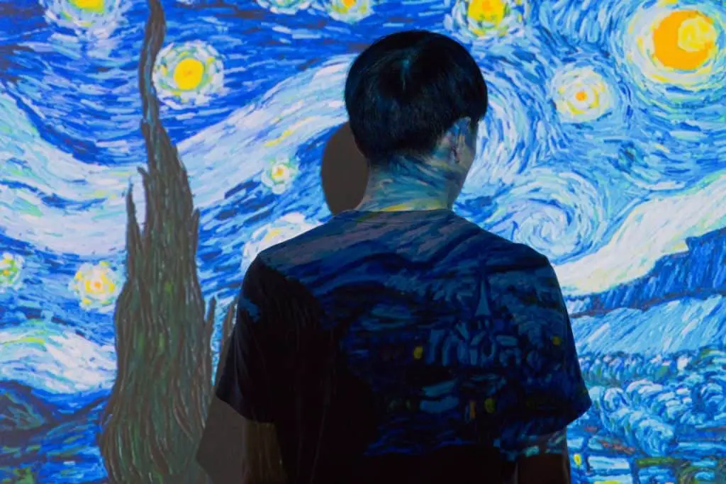 11 Social Media Trends for 2023: The Solopreneur's Ultimate Guide to Actionable Strategies 1 social media trends for 2023 - man in front of starry night painting - edutainment